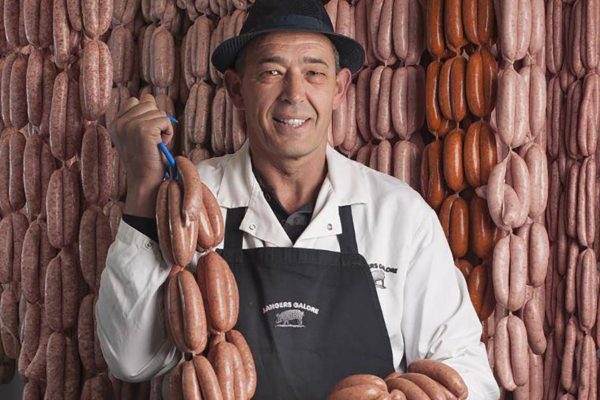 Bangers Galores David Bell posing with sausages